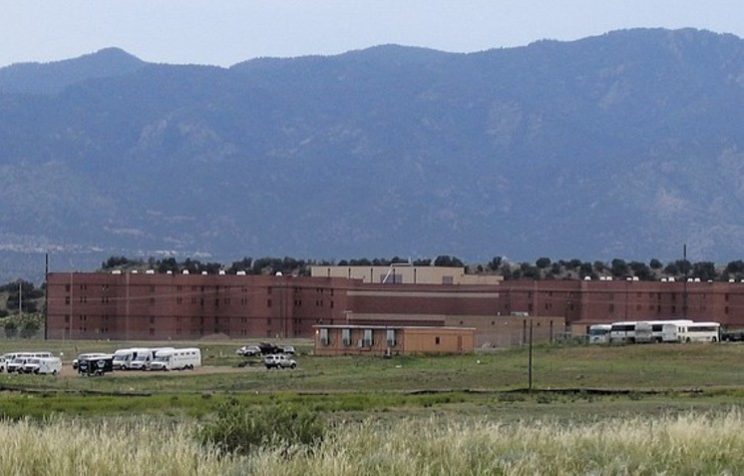 View of Colorado State Penitentiary with mountains in background