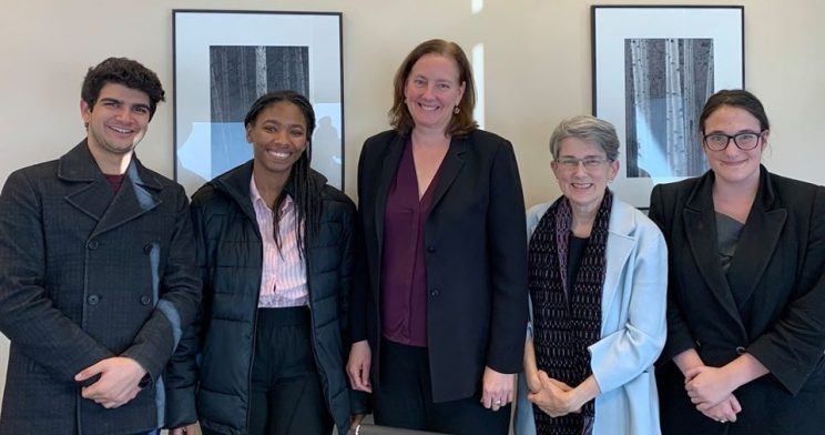 One man and four women standing together. Pictured are Disability Law Uniteds two January externs, attorney Gail Johnson, Co-executive Director, Amy Robertson, and paraleagal, Marieme Diop