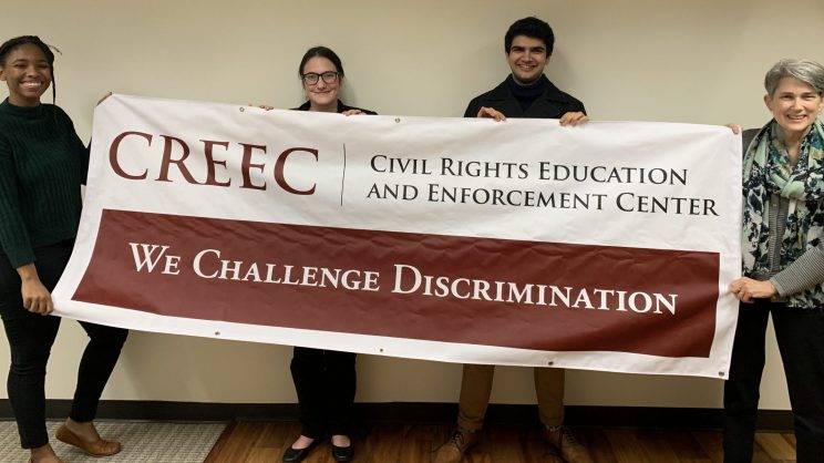 All four Swarthmore affiliates are pictured. The two January 2020 externs, Marieme Diop and Amy Robertson. They are holding the Disability Law United banner in front of them.